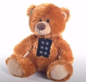 Teddy bear Braillik, an educational toy for children to learn braille