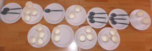 In our photo, you can see paper plates, decorated with cups and spoons to spell out Braille 200 in Braille.